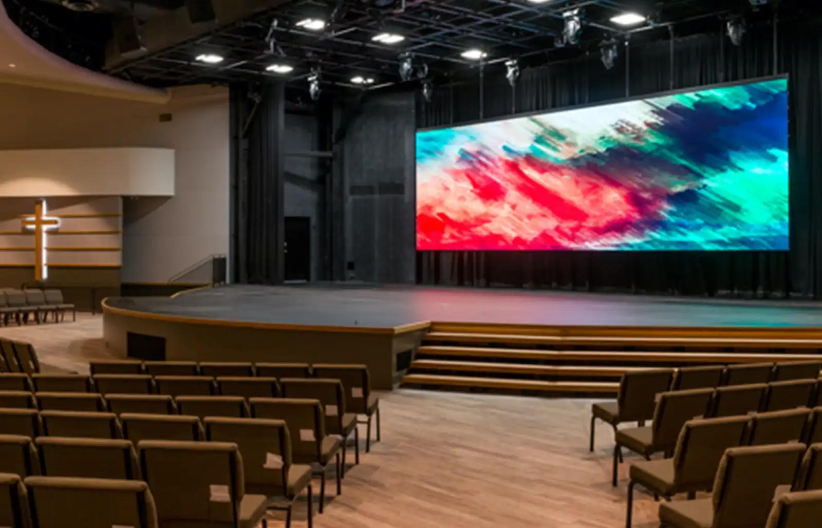 LED screen and stage lighting in modern auditorium setup for live presentations or worship events