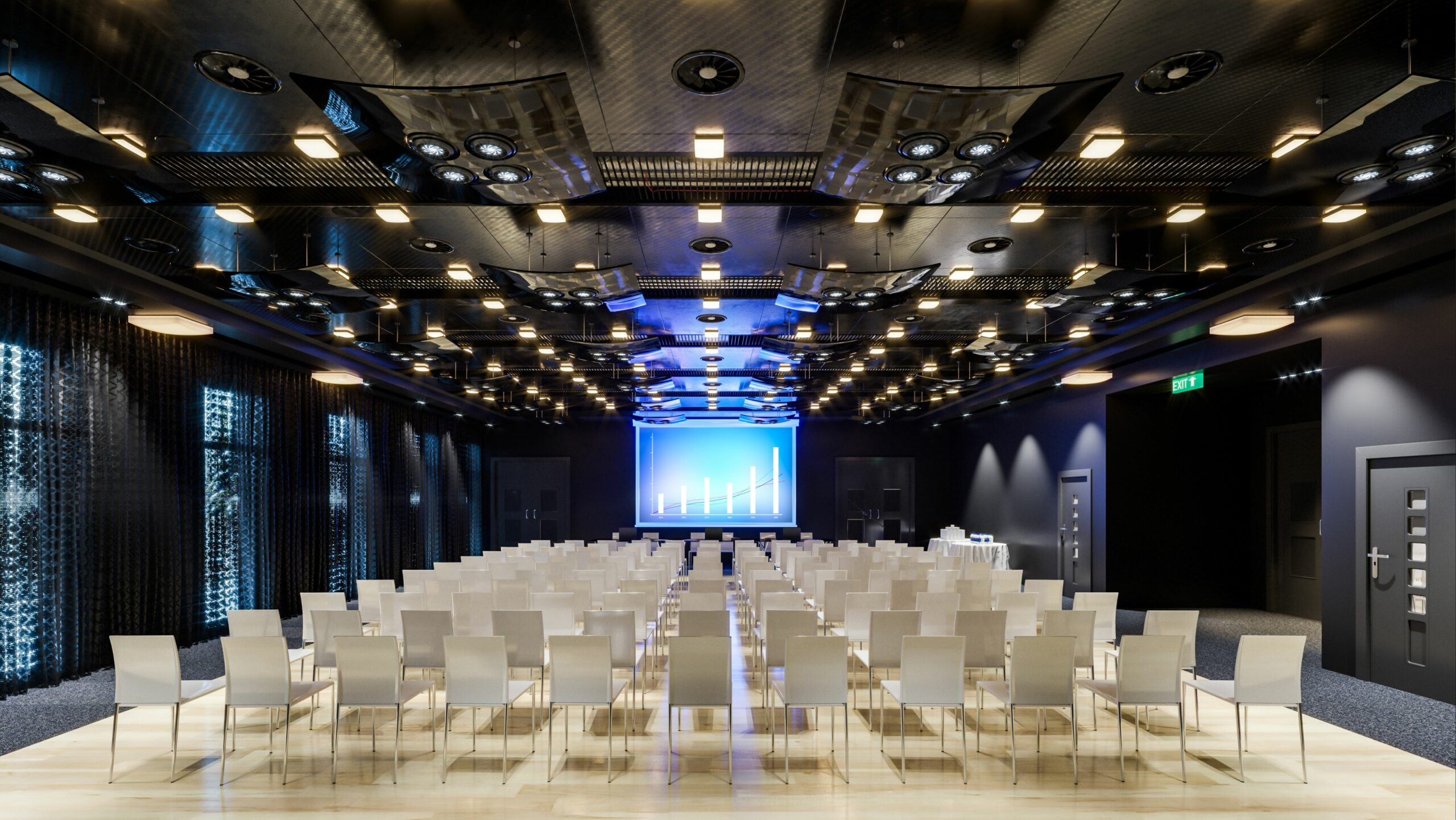 Spacious conference room with AV-ready seating and projection screen setup for corporate presentations and sales meetings